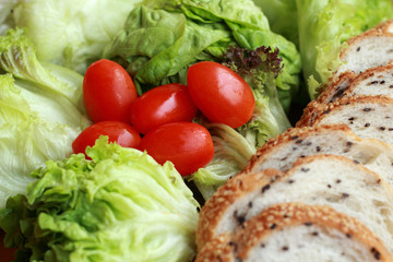 bread sprinkled with sesame -  vegetable green salad