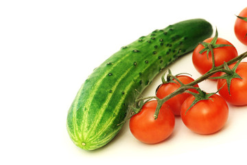Red cherry tomatoes and green cucumber