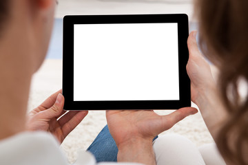 Young couple looking at a tablet together