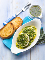 marinated tomino cheese with herbs