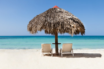 Lounge chairs under sunshade