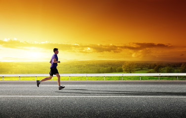 Obraz premium sunset and running young man