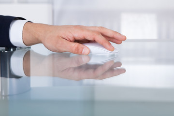 Businessman's Hand Using Wireless Mouse