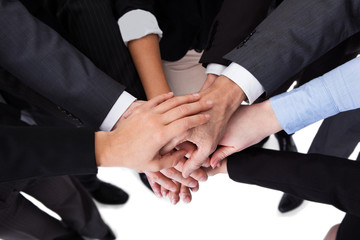 Business people stacking hands