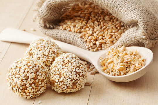 balls from wheat sprouts with sesame seeds, sprouted grains