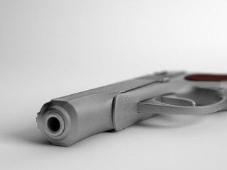 Closeup of handgun on white background