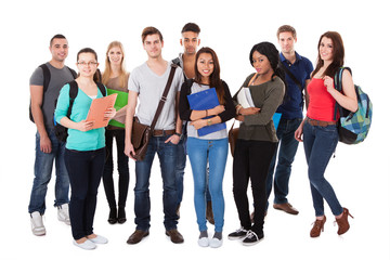 Confident University Students Walking Over White Background