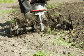 Farmer working with plow machine