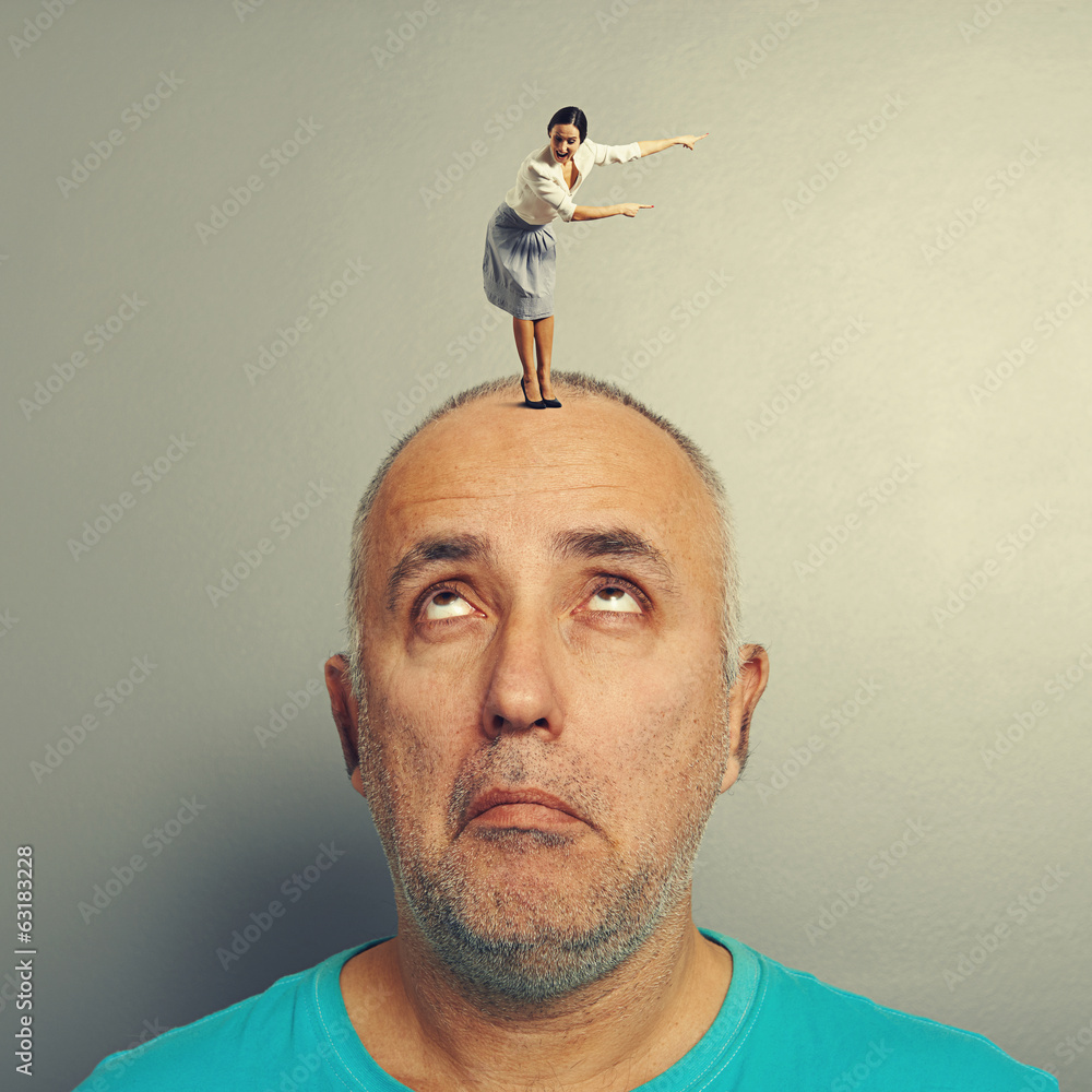 Poster man looking at excited woman