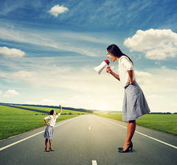 big woman with megaphone and small woman