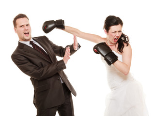 Wedding couple. Bride boxing groom. Conflict.