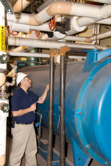 Plumber testing boiler