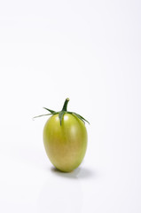 Bunch of fresh tomatoes with water drops. Isolated on white back
