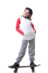 Naklejka premium Merry little skateboarder posing looking up