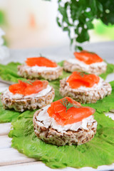 Delicious canapes on table close-up