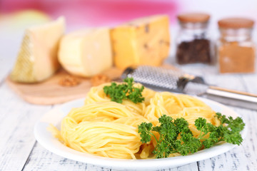 Composition with tasty spaghetti, grater, cheese, and spices