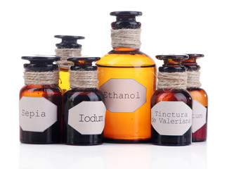 Historic old pharmacy bottles with label  isolated on white