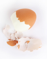 Peeled boiled egg isolated on white