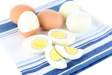 Boiled eggs on color napkin isolated on white