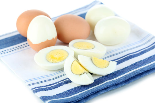 Boiled eggs on color napkin isolated on white