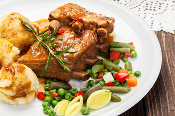 Pork spareribs served with mashed potatoes