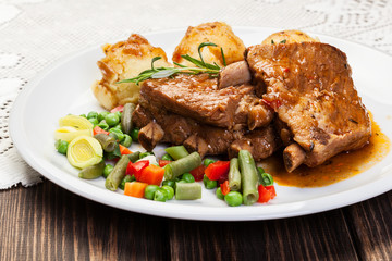 Pork spareribs served with mashed potatoes