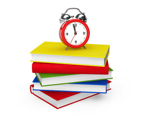 Red Alarm clock standing on stack of books