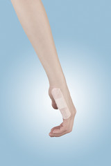 Adhesive Healing plaster on finger.