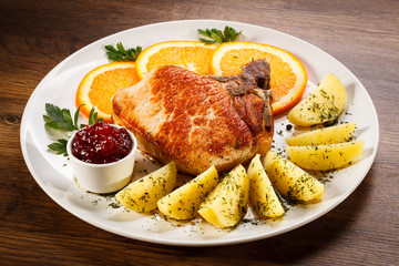 Grilled steak, boiled potatoes and lingonberry jam