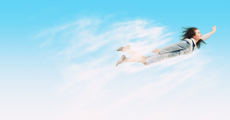 Naklejka premium Flying businesswoman