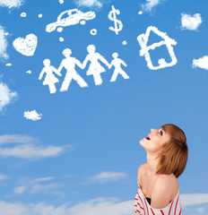 Young girl daydreaming with family and household clouds
