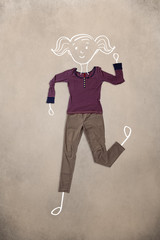 Placed clothes in action with woman drawing