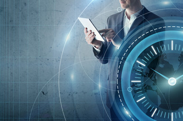 Businessman with tablet computer and digital clock interface