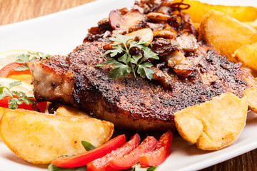 Fried pork chop with mushrooms and chips