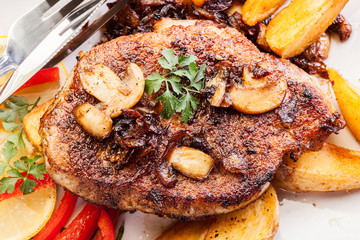 Fried pork chop with mushrooms and chips