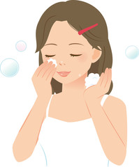 泡で洗顔する若い女性