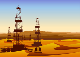 Landscape whith oil rigs in barren desert with sand dunes.