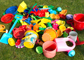 Plastic toys in the garden - 63207252