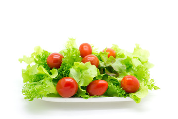 Red tomatoes and green lettuce.