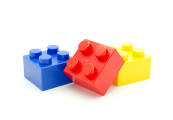 Plastic building blocks on white background