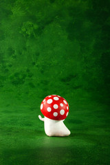 cute puppets handmade, one mushrooms, green background