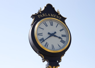 Fototapeta na wymiar Vintage clock against blue sky