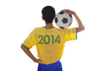 Soccer player holding ball isolated