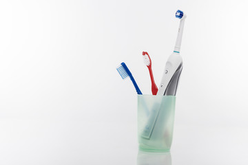 Electric and Manual Toothbrushes in One Cup Together