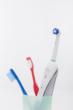 Electric and Manual Toothbrushes in One Cup Together