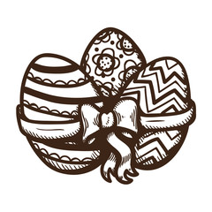 Three eegs with ribbon and bow.