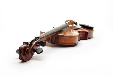 Old scratched violin, isolated on white background.