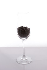 isolated of wine glass with coffee beans on white background