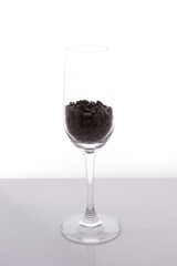 isolated of wine glass with coffee beans on white background