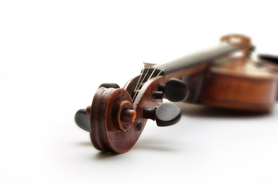 Detail of old scratched violin, isolated on white background.